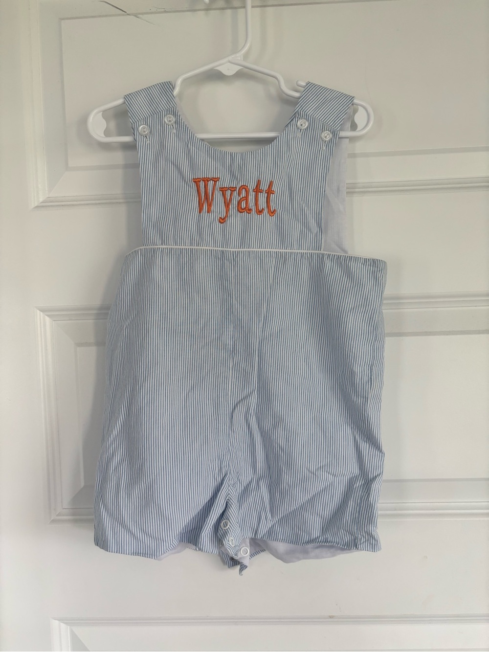 Monogrammed Blue Pinstripe Kids Romper with Orange Name

Wyatt